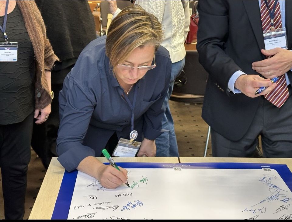 Melanie Gottlieb signing the Paris Declaration at EPIC 2024